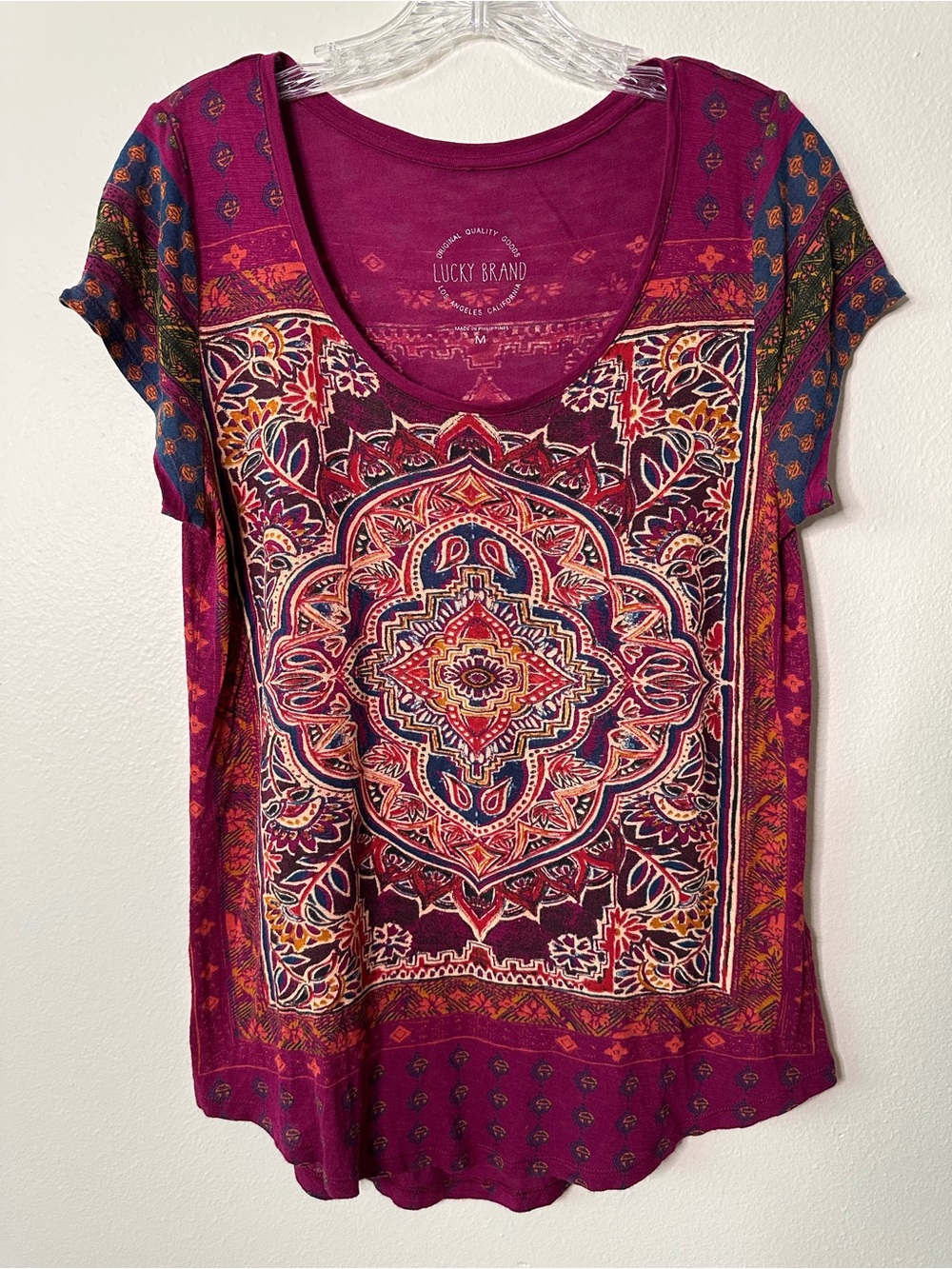 Lucky Brand size medium with short sleeves. Front and back design match